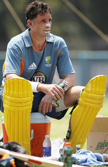 Michael Hussey looks on after batting during nets
