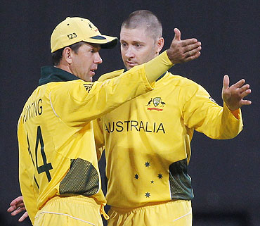 Australian captain Ricky Ponting and Michael Clarke discuss field placements