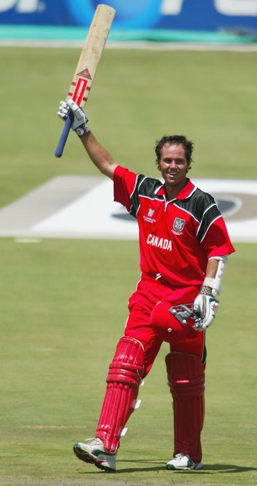Canada's John Davison celebrates after scoring the fastest hundred in World Cup history during the Pool B match between West Indies and Canada on February 23, 2003