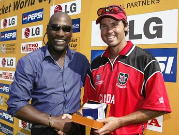Former West Indies captain Viv Richards presents the Man of the Match award to John Davison after 2003 World Cup Pool B match between West Indies and Canada