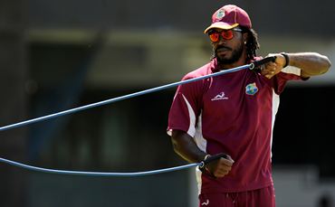Chris Gayle goes through a harness exercise during training