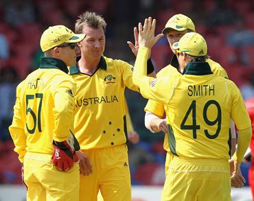 Brett Lee is congratulated by teammates after picking a wicket