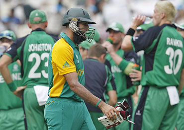 South Africa's Hashim Amla walks off the field after his dismissal