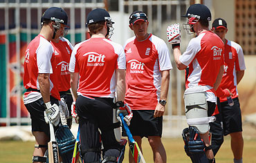 England coach Andy Flower has a chat with his batsmen during a practice session