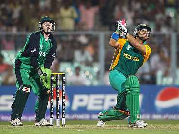 South Africa's JP Duminy plays a shot as Ireland's Nail O'Brien looks on