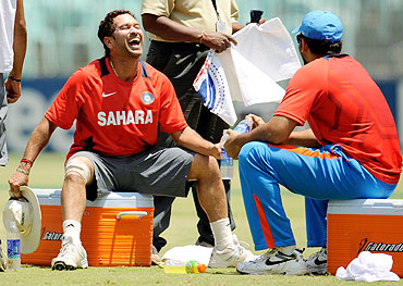 India's Sachin Tendulkar laughs during a net session on Friday