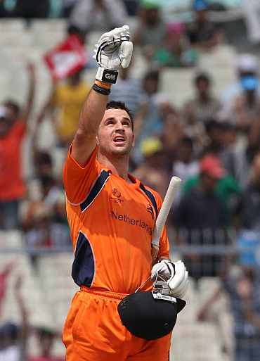 Ryan ten Doeschate reacts after completing his century