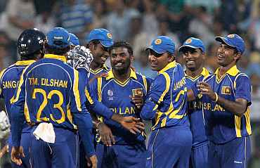 Sri Lanka's Muttiah Muralitharan celebrates after picking up a New Zealand wicket