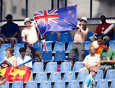 Supporters of New Zealand hold up a flag during the match between New Zealand and Sri Lanka at  the Wankhede Stadium on Friday