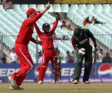 Zimbabwean players appeal for a Kenya wicket during their match in Kolkata