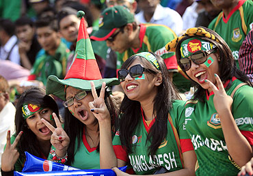 Bangladesh fans cheer during the match between India and Bangladesh