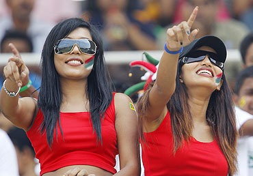 Sri Lanka cricket fans dance in the stands during Sri Lanka's match against Pakistan