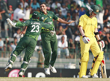 Pakistan's Abdul Razzaq (right) celebrates after taking the wicket of Australia's Michael Clarke
