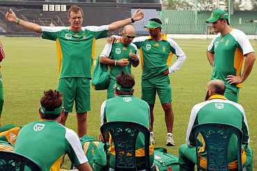 South African coach Corrie van Zyl speaks to South African players during a practice session