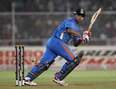 Suresh Raina plays a leg glance during his match against Australia