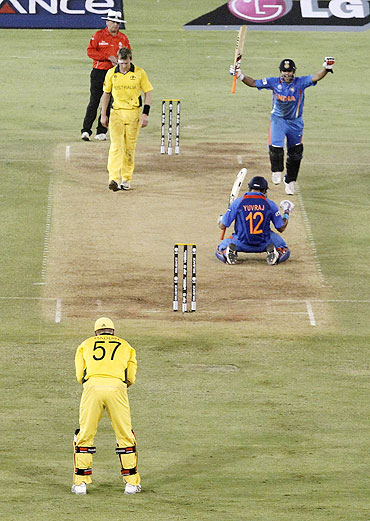 India's Suresh Raina, right, and Yuvraj Singh celebrate after defeating Australia