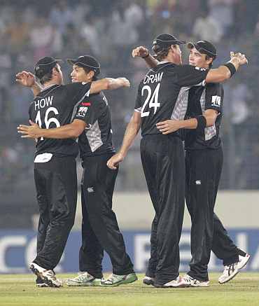 New Zealand players celebrate after winning their quarter-final match against South Africa