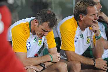 South African coach Corrie van Zyl reacts after losing the match against New Zealand