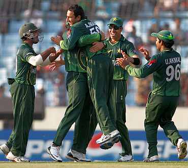 Saeed Ajmal celebrates after picking up a wicket