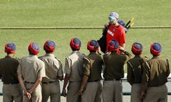 Security personnel take pictures of Yuvraj Singh at Mohali ahead of the India-Pakistan World Cup match