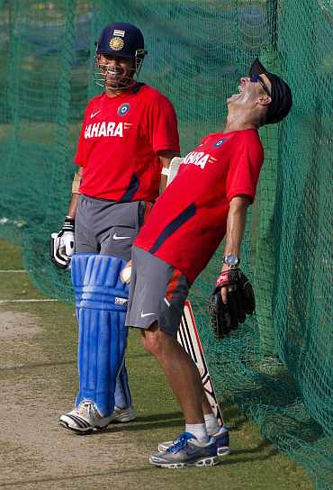 Coach Gary Kirsten laughs along with Sachin Tendulkar during a practice session