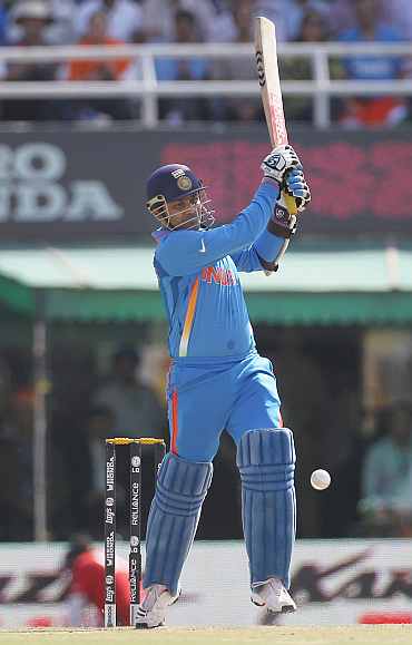India's Virender Sehwag plays a shot during his semi-final match against Pakistan