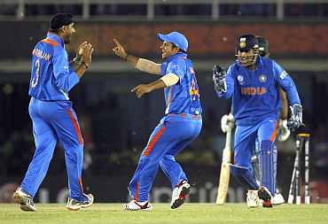 The Indian team celebrates after defeating Pakistan in the semi-final