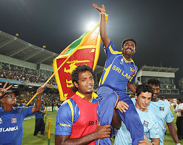 Muttiah Muralitharan of Sri Lanka acknowledges the crowd after playing his last match in Sri Lanka on Tuesday