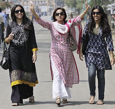 Pakistan fans arrive in India through the India-Pakistan joint check post at the Wagah border