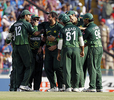 Pakistan's captain Shahid Afridi (3rd from left) is congratulated by teammates