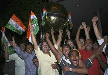 Fans celebrate in Hyderabad after India won the their World Cup semi-final against Pakistan