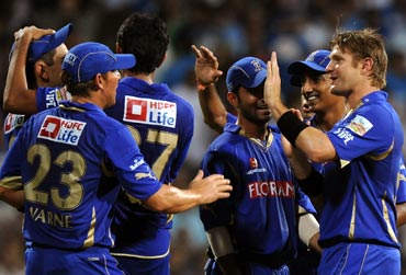 Shane Watson celebrates with team-mates the wicket of Ambati Rayudu