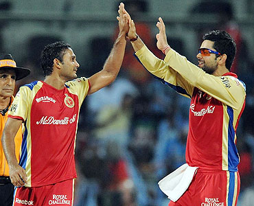 Syed Mohammad (left) celebrates with Virat Kohli