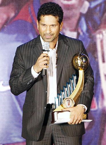 India's Sachin Tendulkar with India's Best Cricketer of the year award for the year 2009-10