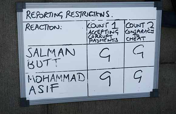 A whiteboard used by reporters shows that former Pakistan cricket captain Butt and cricketer Asif have both been found guilty
