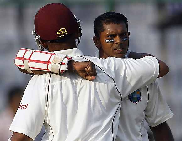 Shivnarine Chanderpaul celebrates after completing his century