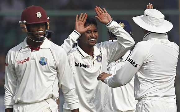 Pragyan Ojha celebrates after dismissing Kieron Powell