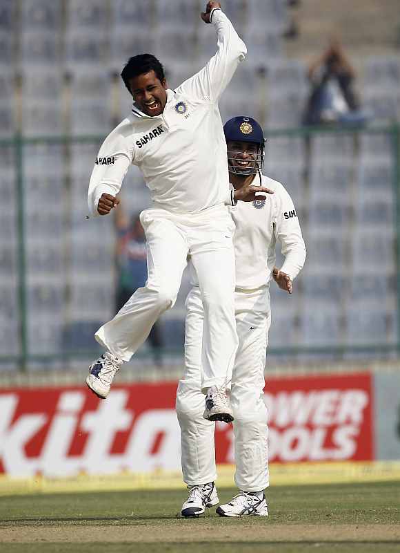 Pragyan Ojha celebrates after picking up a wicket