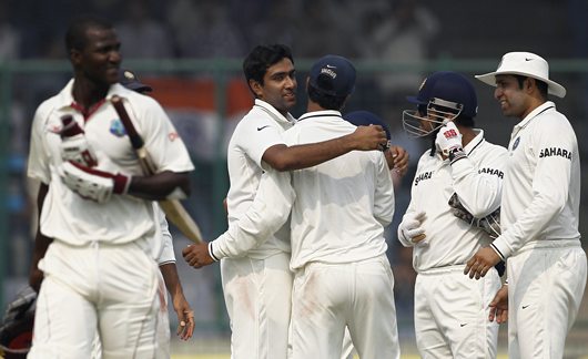 Ashwin is congratulated by teammates after dismissing West Indies captain Darren Sammy