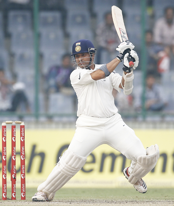 India's Sachin Tendulkar plays a shot during the third day of their first test cricket match against West Indies in New Delhi