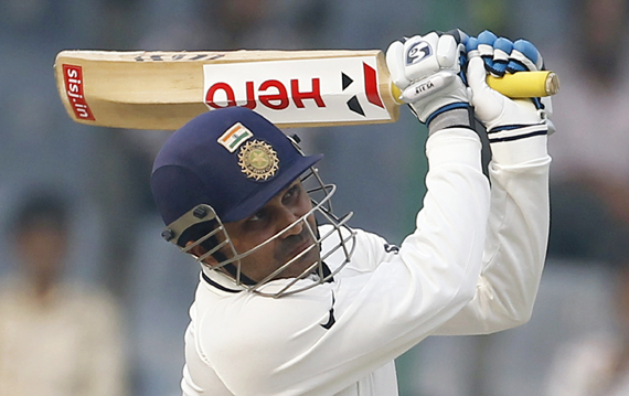 India's Virender Sehwag plays a shot during the third day of their first test cricket match against the West Indies in New Delhi