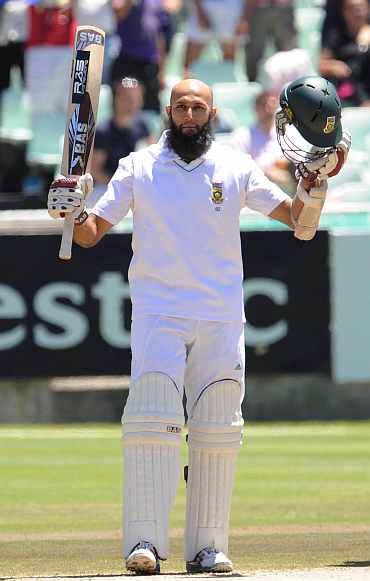 Hashim Amla celebrates after completing his century