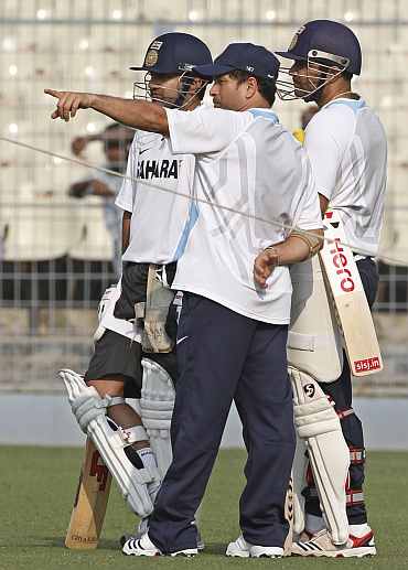 Gautam Gambhir, Sachin Tendulkar and Virender Sehwag take a break during a practice session