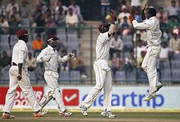 West Indies players celebrate after picking up a wicket