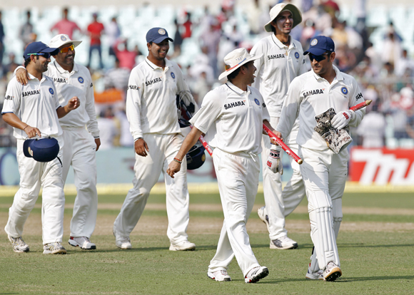 (L-R) Gautam Gambhir, Virender Sehwag, Pragyan Ojha, Sachin Tendulkar, Ishant Sharma and captain Mahendra Singh Dhoni walk back to the pavilion after India won the second Test