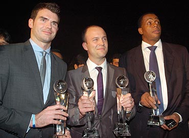 James Anderson, Jonathan Trott and Courtney Walsh with their awards