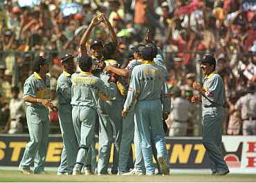 Indian team celebrates after a fall of a wicket during the 1996 World Cup