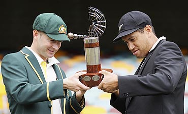 Australia's captain Michael Clarke (left) and New Zealand's captain Ross Taylor hold the Trans Tasman Trophy