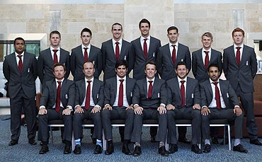 The England team poses for a photograph before departure for India