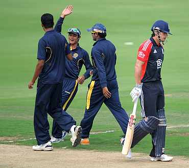 Anwar Ahmed celebrates after picking the wicket of Alastair Cook